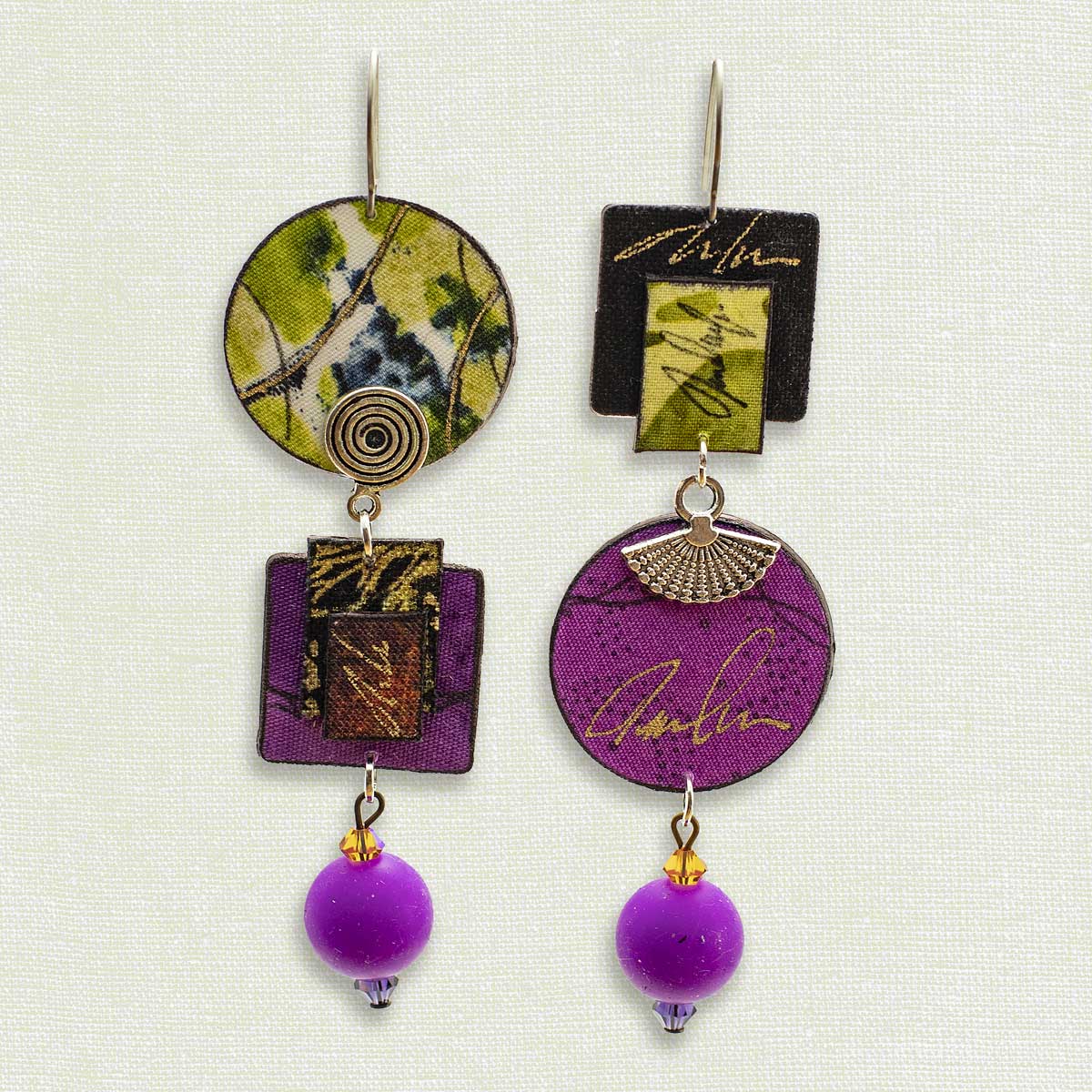 Asymmetric 3 tiered earrings, hand painted by artist Suzanne Bellows for SuzanneBellowsJewelry.com. This pair is part of the Earth Collection and features pinks, greens and magentas