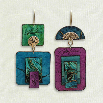 Asymmetric 2 tiered earrings hand painted by artist Suzanne Bellows for SuzanneBellowsJewelry.com. THis pair is part of the Water Collection and features blues, purples  greens.