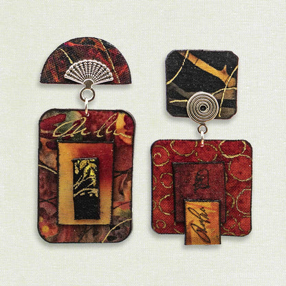 Asymmetric 2 tiered earrings hand painted by artist Suzanne Bellows for SuzanneBellowsJewelry.com.  The desing is varoius tones of red and is part of the Earth Collection